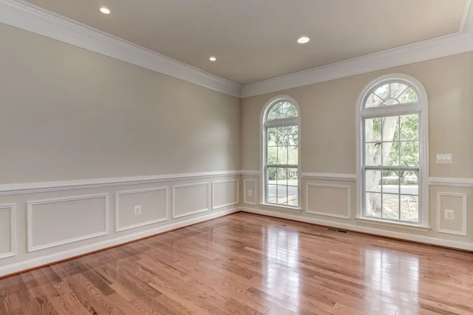 Living room before, bare and dated