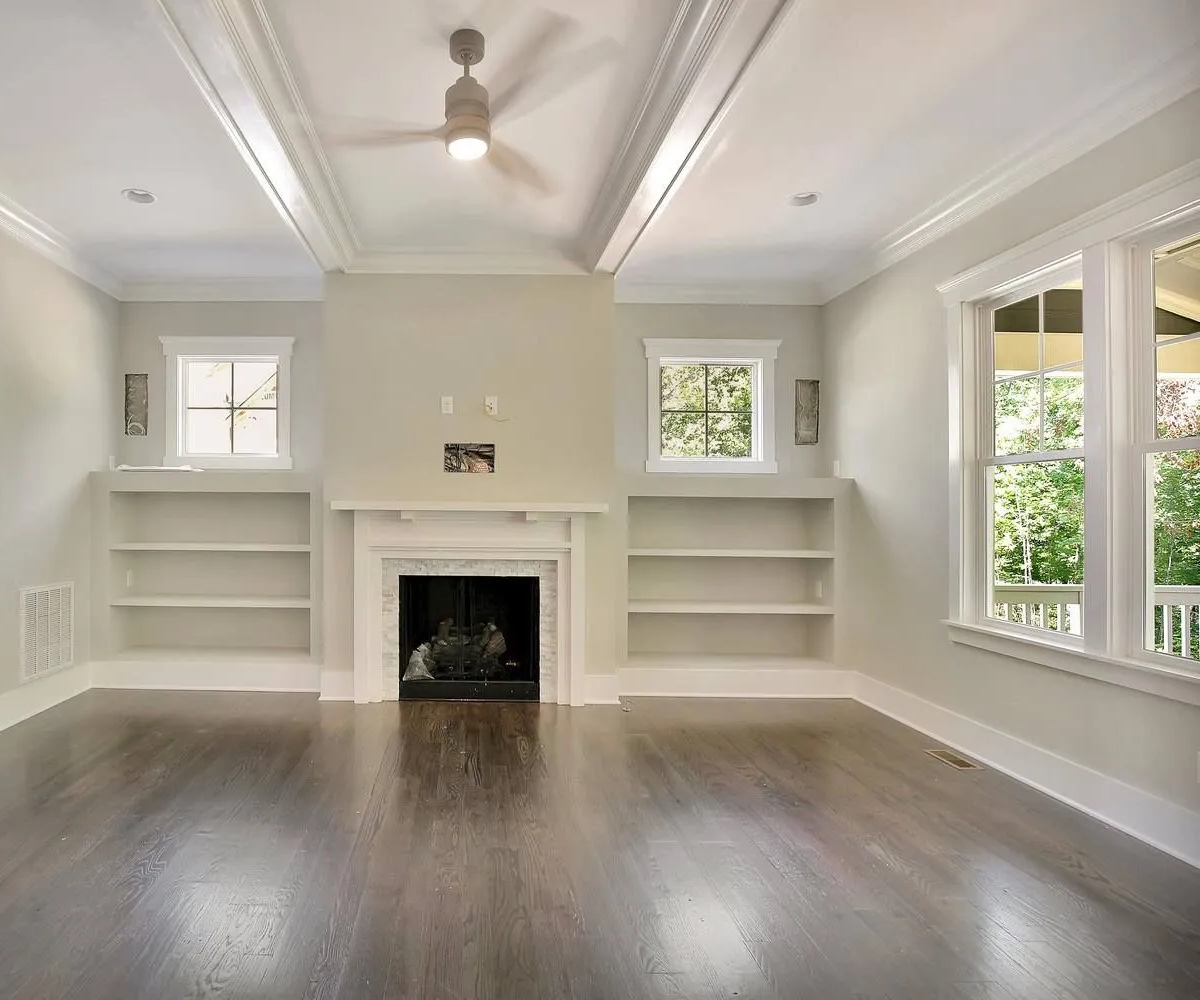 Living room before: dated, with bare walls